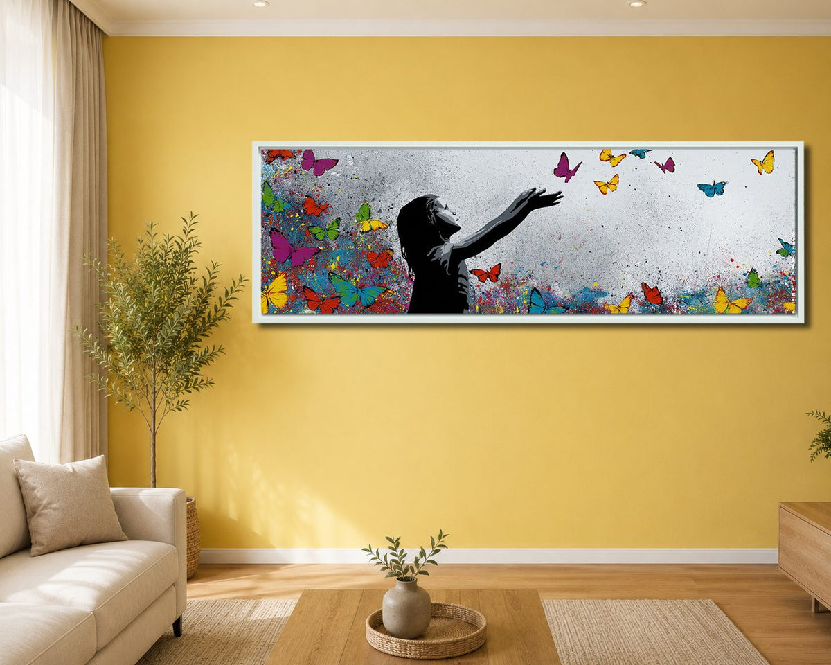 Girl Releasing Colorful Butterflies canvas wall art, white floating frame